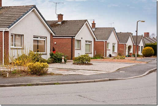 Sameness reflected in a row of identical suburban houses