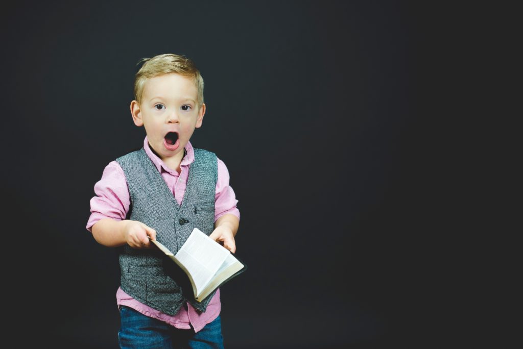 child holding Bible